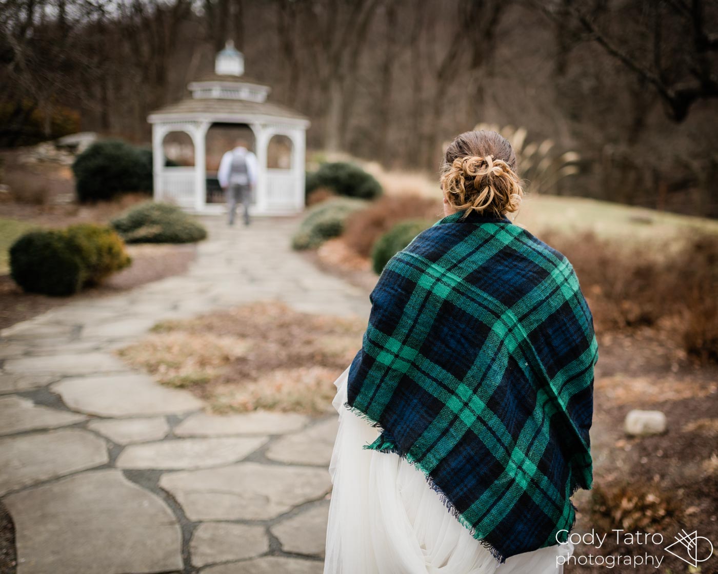 Winter Wedding Traditions winter-wedding-bride-groom-first-look-by-gazebo