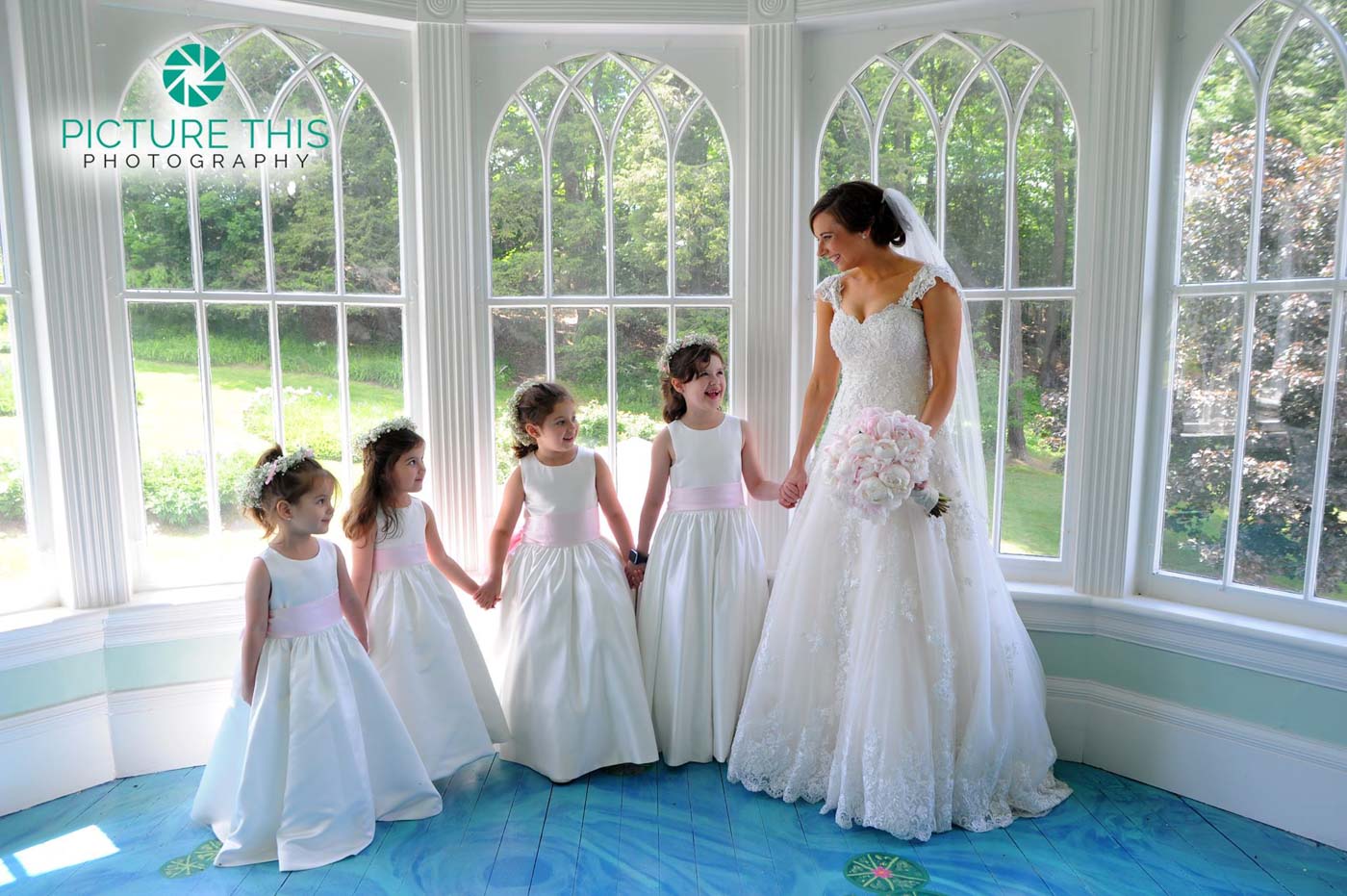 Alumni Bride's Sweet Moments immaculate-bride-with-four-little-girls-on-lilly-pond-porch