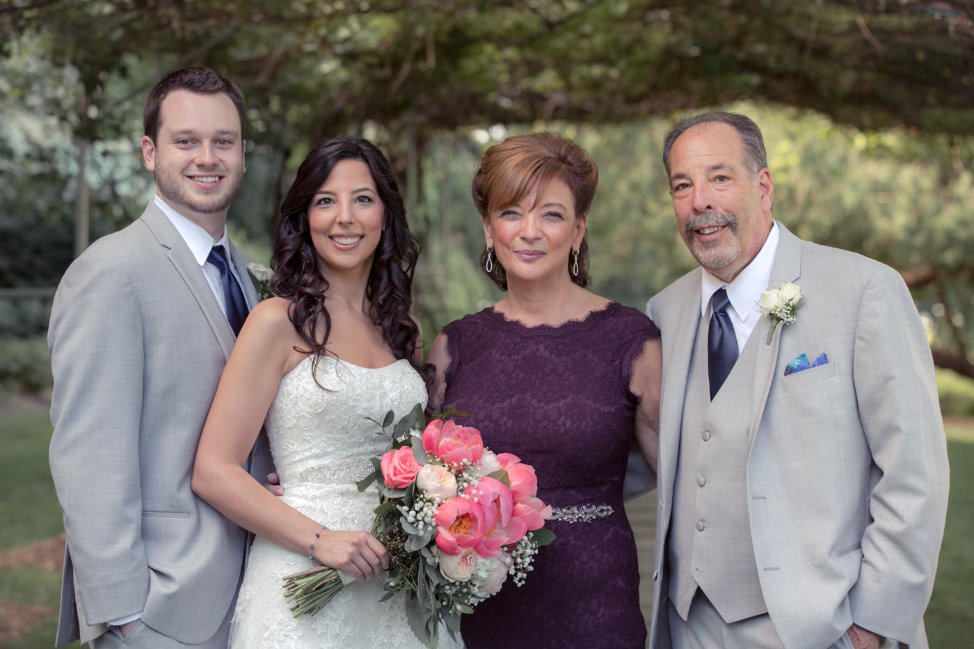 Wedding Memories wedding-couple-with-mom-dad-under-grape-arbor