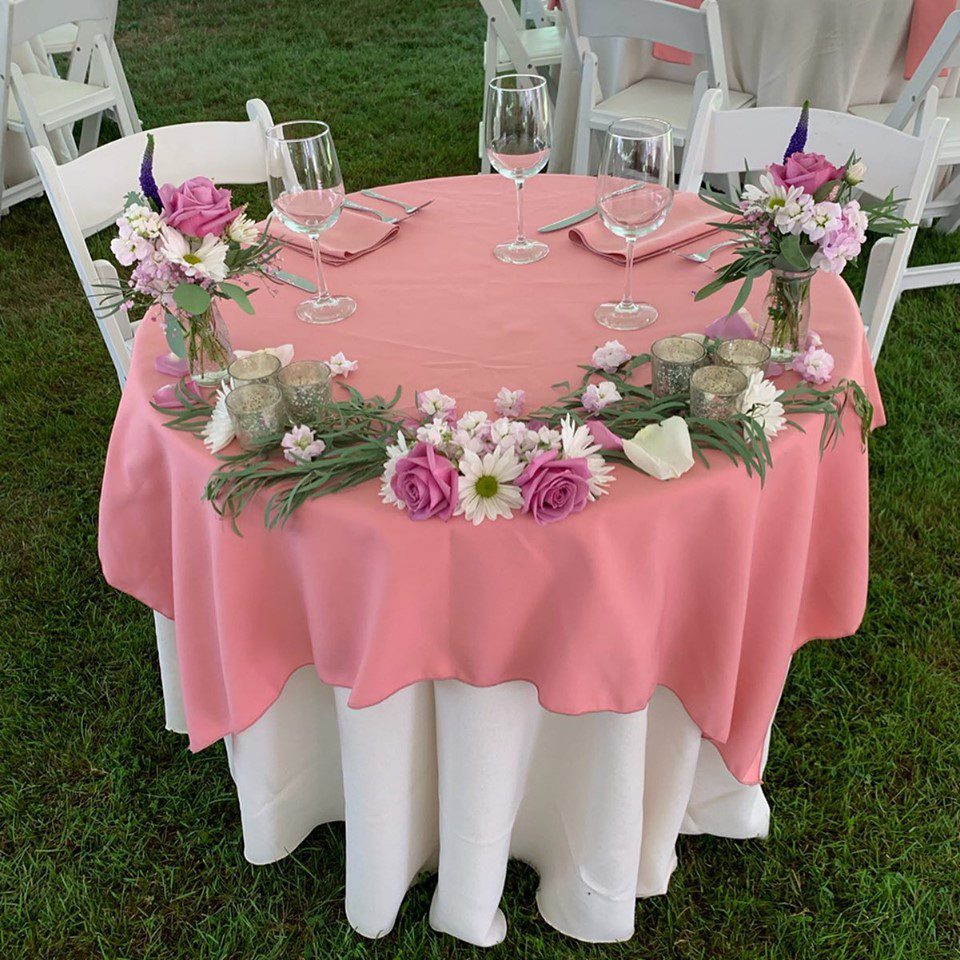 A July Tent Wedding july-tent-wedding-head-table-pink-with-flowers